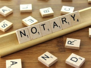 scrabble letters spelling out notary